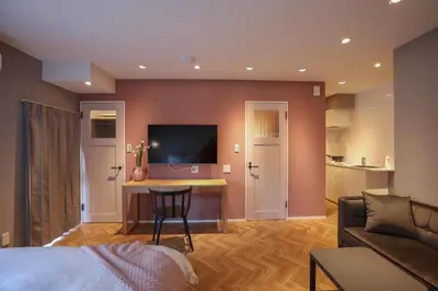 a living room with a bed and a table and a couch at ZDt-612-SJ0152 in Tokyo