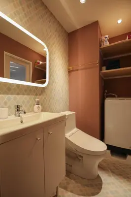 a bathroom with a toilet and a sink and a mirror at ZDt-612-SJ0152 in Tokyo