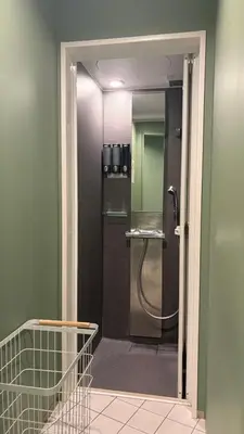 a bathroom with a shower with a glass door at Book Tea Bed SHIBUYA in Tokyo