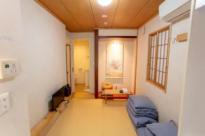 a hospital room with a couch and a tv at \u548c\u7e01WAEN SKYTREE in Tokyo