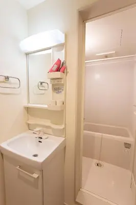 a white bathroom with a sink and a shower at \u548c\u7e01WAEN SKYTREE in Tokyo