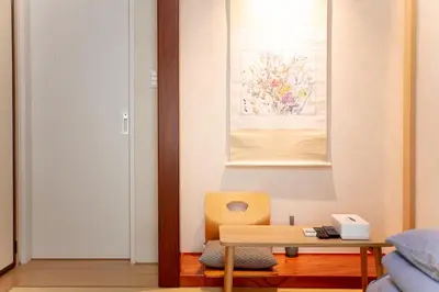 a room with a table and a chair and a painting at \u548c\u7e01WAEN SKYTREE in Tokyo