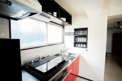 a small kitchen with a sink and a stove at PREMIER suite Shinjuku Akebonobashi front in Tokyo