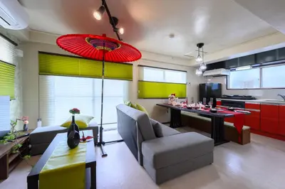 a living room with a table and a kitchen at PREMIER suite Shinjuku Akebonobashi front in Tokyo