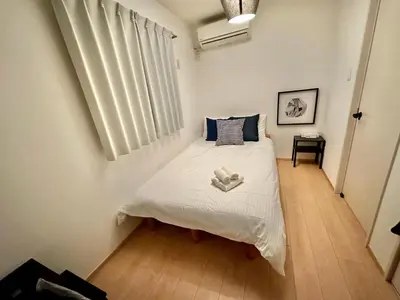 a small bedroom with a bed in a room at One-Ikebukuro TS0230 in Tokyo