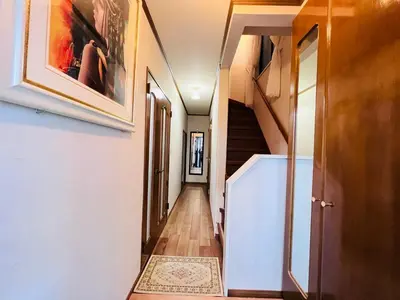 a hallway of a house with stairs and a rug at Ikebukuro Sta 8 mins Good Access Modern House TS0318 in Tokyo
