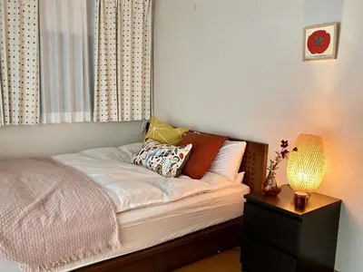 a bed with pillows on it in a bedroom at Ikebukuro Sta 8 mins Good Access Modern House TS0318 in Tokyo