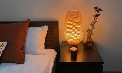 a lamp on a table next to a bed at Ikebukuro Sta 8 mins Good Access Modern House TS0318 in Tokyo