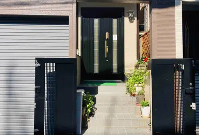 a black front door of a house with plants at Ikebukuro Sta 8 mins Good Access Modern House TS0318 in Tokyo