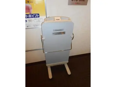 an old refrigerator sitting next to a wall at R & B Hotel Kamata Higashiguchi - Vacation STAY 38814v in Tokyo
