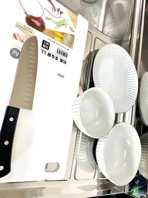 a bunch of plates and a knife in a drawer at COCO Nakameguro 202 in Tokyo