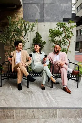 a group of three people sitting in chairs at Section L Hamamatsucho in Tokyo