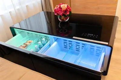 a drawer in a cabinet with a vase of flowers at \u6e0b\u8c37 \u5e83\u308150m2 2LDK \u4ee3\u3005\u6728\u516c\u5712\u99c5\u5f92\u6b695\u5206 \u5bb6\u65cf\u306b\u304a\u3059\u3059\u3081 in Tokyo