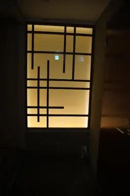 a window in a dark room with the words lighted at Guest House Tokyo Samurai in Tokyo