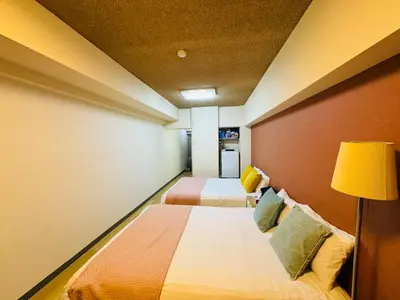 a hotel room with two beds and a lamp at Kabukicho-503-SJ0010 in Tokyo