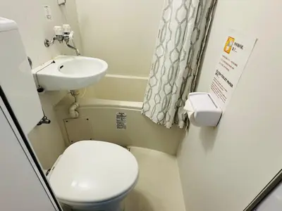 a small bathroom with a toilet and a sink at Kabukicho-503-SJ0010 in Tokyo