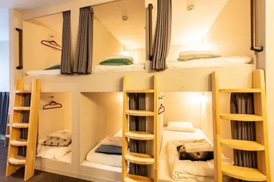 a group of bunk beds in a room at Akasaka The Hostel in Tokyo