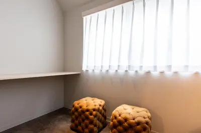 two chairs sitting in a room with a window at Akasaka The Hostel in Tokyo