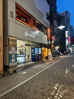 an empty street in a city at night at Akasaka The Hostel in Tokyo