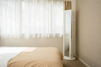 a bedroom with a bed and a large window at ILIMA Higashi Nakano - Vacation STAY 89452v in Tokyo