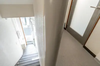 a hallway with a stairway with a door and a stair at ILIMA Higashi Nakano - Vacation STAY 89452v in Tokyo