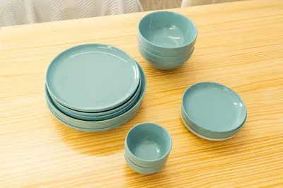 four bowls and plates sitting on a table at ILIMA Higashi Nakano - Vacation STAY 89452v in Tokyo