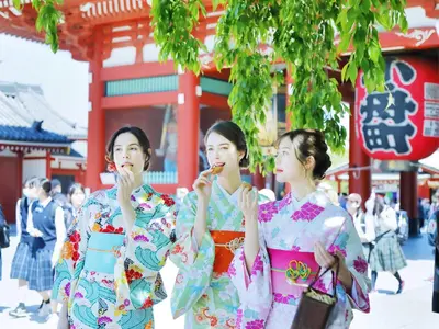 three women in kimonos standing in front of a building at &Here TOKYO UENO in Tokyo