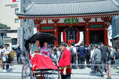 a group of people riding in a horse drawn carriage at &Here TOKYO UENO in Tokyo