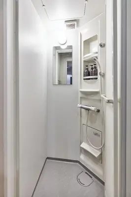 a bathroom with an open refrigerator in a room at Tora Hotel Asakusa in Tokyo