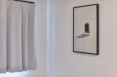 a picture of a door with a window and a mirror at Tora Hotel Asakusa in Tokyo
