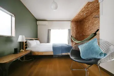 a bedroom with a bed and a desk and a chair at \u3077\u3075\u304b\u4e21\u56fd\u3000\uff08pufuka Ryogoku) in Tokyo