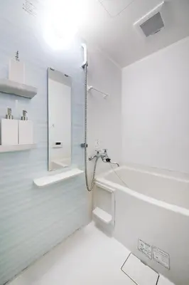 a bathroom with a tub and a sink and a mirror at \u3077\u3075\u304b\u4e21\u56fd\u3000\uff08pufuka Ryogoku) in Tokyo