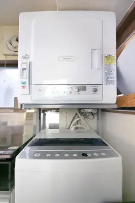 a microwave sitting on top of a kitchen appliance at \u3077\u3075\u304b\u4e21\u56fd\u3000\uff08pufuka Ryogoku) in Tokyo