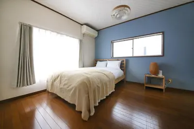 a bedroom with a bed and a large window at \u3077\u3075\u304b\u4e21\u56fd\u3000\uff08pufuka Ryogoku) in Tokyo