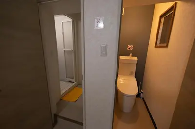 a small bathroom with a toilet in a room at Hostel Belle Via Tokyo in Tokyo