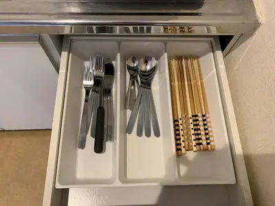 a white tray with utensils in a drawer at Spacious studio(62m2) in western Shinjuku in Tokyo