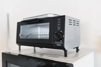 a microwave oven sitting on top of a table at Spacious studio(62m2) in western Shinjuku in Tokyo