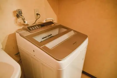 a fax machine sitting on top of a refrigerator at North Shinjuku house 5\u99c5\u5f92\u6b69\u570f\u5185\u306e\u5317\u65b0\u5bbf\u306e\u5bb6 in Tokyo