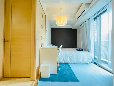 a bedroom with a bed and a large window at Nishishinjuku 902-SJ0367 in Tokyo