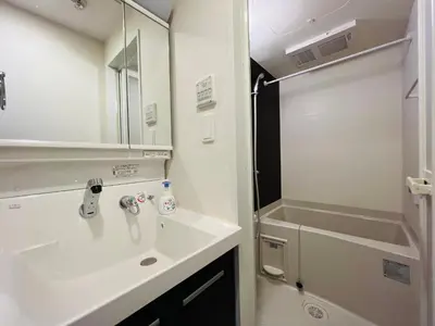 a white bathroom with a sink and a shower at Nishishinjuku 902-SJ0367 in Tokyo