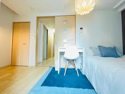 a bedroom with a desk and a bed and a chair at Nishishinjuku 902-SJ0367 in Tokyo