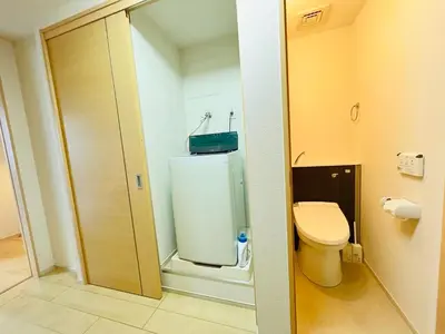 a small bathroom with a toilet and a shower at Nishishinjuku 902-SJ0367 in Tokyo