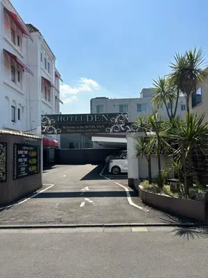 a parking lot with a sign for a hotel at \u30db\u30c6\u30ebDEN in Tokyo