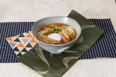 a bowl of soup with noodles and a marshmallow in it at \u30db\u30c6\u30ebDEN in Tokyo
