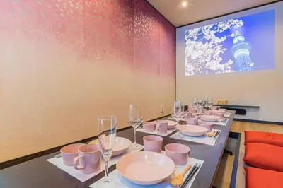 a long table with plates and wine glasses on it at Ukiyoan Takasago in Tokyo