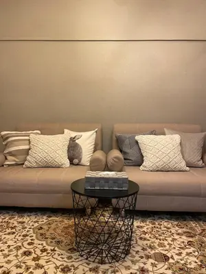 a living room with a couch with pillows and a table at Best Shinjuku Modern Full-furnished Family size Apartment4 ONLY 2min to Shinjuku by Train in Tokyo