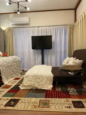 a living room with a flat screen tv and a couch at Best Shinjuku Modern Full-furnished Family size Apartment4 ONLY 2min to Shinjuku by Train in Tokyo