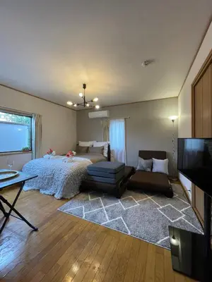 a living room with a bed and a couch at Best Shinjuku Modern Full-furnished Apartment2 ONLY 2min to Shinjuku by Train in Tokyo