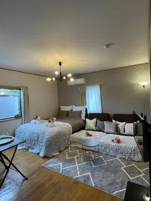 a living room with a bed and a couch at Best Shinjuku Modern Full-furnished Apartment2 ONLY 2min to Shinjuku by Train in Tokyo