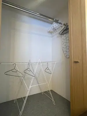 a walk in closet with hangers and a glass door at Best Shinjuku Modern Full-furnished Apartment2 ONLY 2min to Shinjuku by Train in Tokyo